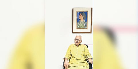 Lalu Prasad Shaw in front of one his tempera paintings 