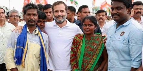 Congress leader Rahul Gandhi meets Shobha, mother of a 15-year-old boy, who was fined for touching a deity at Ullerahalli village in Malur taluk. (Photo | EPS)