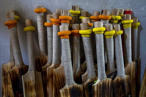 Finished cricket bats are seen inside a factory in Sangam, south of Srinagar. (Photo | AP)