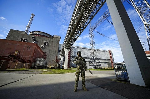A Russian serviceman guards in an area of the Zaporizhzhia Nuclear Power Station in territory under Russian military control. (Photo | AP)