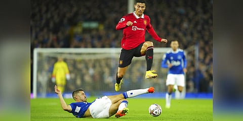 Everton's Conor Coady tries to tackle Manchester United's Cristiano Ronaldo during the Premier League soccer match between Everton and Manchester United at Goodison Park, in Liverpool. (Photo | AP)