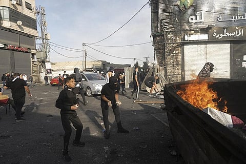 Palestinians clash with Israeli security forces in Shuafat refugee camp in Jerusalem, Wednesday, Oct.12. 2022. (Photo | AP)