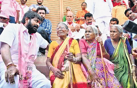 Excise and Prohibition Minister V Srinivas Goud talks to voters during an election campaign in Munugode constituency on Wednesday