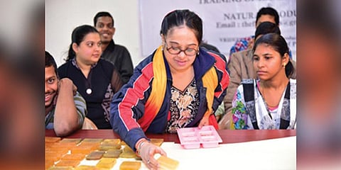 Group of girls with autism and Down Syndrome making soaps at Vriddhi centre.