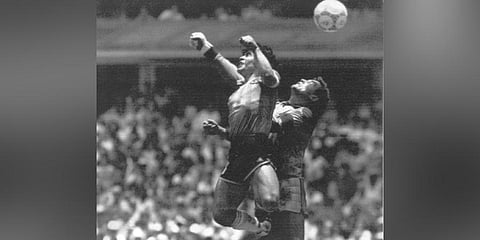 Argentina's Diego Maradona, left, beats England's goalkeeper Peter Shilton to a high ball and scores his first of two goals at the World Cup quarterfinal soccer match in Mexico City. (File photo | AP)