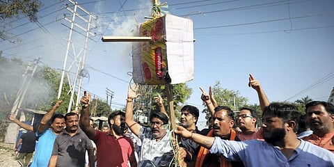 Rashtriya Bajrang Dal members burn an effigy during a protest against alleged killing of Kashmiri Pandit Puran Bhat, in Shopian district, Saturday, Oct. 15, 2022. (Photo | PTI)