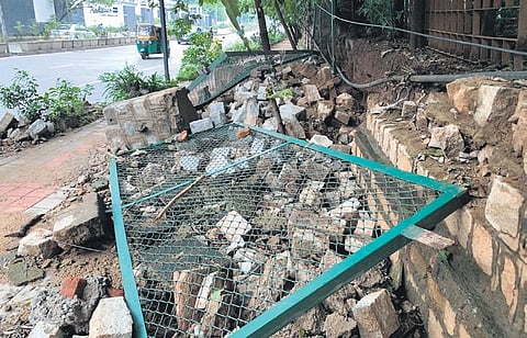 The compound wall of the CID office on Palace Road which collapsed due to heavy rain in Bengaluru, on Sunday | Shashidhar Byrappa
