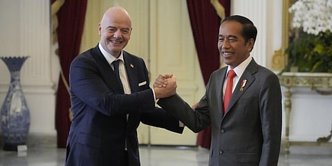 Indonesian President Joko Widodo, right, greets FIFA President Gianni Infantino during their meeting at Merdeka Palace in Jakarta, Indonesia, Tuesday, Oct. 18, 2022. (Photo | AP)