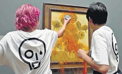 Climate activists throw tomato soup on Vincent van Gogh’s painting ‘Sunflowesr’ in London