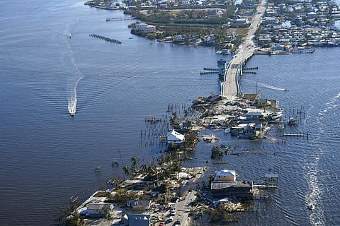 The bridge leading from Fort Myers to Pine Island, Fla., is heavily damaged in the aftermath of Hurricane Ian, Saturday, Oct. 1, 2022. (Photo | AP)