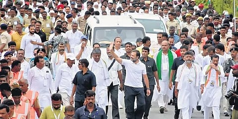 Congress MP Rahul Gandhi waves to the crowd on the second day of the Karnataka leg of Bharat Jodo Yatra, which began from Begur to Kalale in Mysuru district on Saturday | udayshankar s