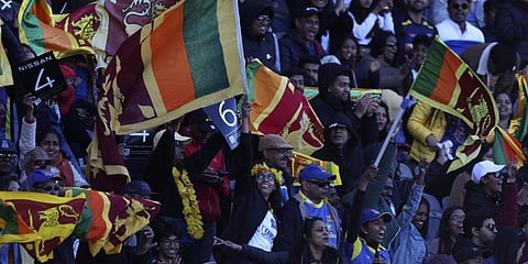Cricket fans wave Sri Lankan flags during the T20 World Cup Cricket match between Sri Lanka and Namibia in Geelong, Australia, Sunday, Oct. 16, 2022. (Photo | AP)