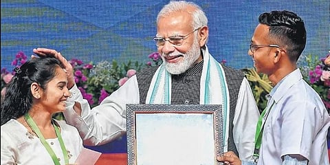 Prime Minister Narendra Modi with students during the launch of the Mission Schools of Excellence initiative at Trimandir, Adalaj, in Gujarat on Wednesday | PTI