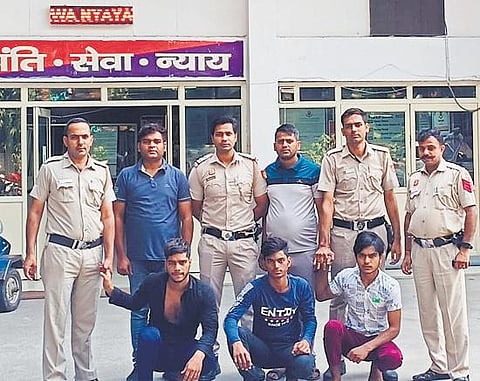 Police with three of the accused in the killing | express