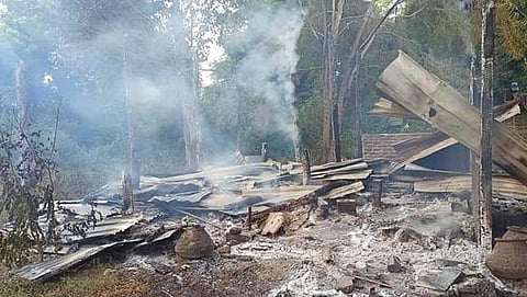 Smoke rises from debris and corrugated roofing of a school structure that was burned to the ground in Taung Myint village in the Magway region of Myanmar. (Photo | AP)