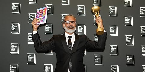 Author Shehan Karunatilaka holds the Booker Prize during a photo call after the announcement of his victory, at the Roundhouse, in London, Monday, Oct. 17, 2022.(Photo | AP)