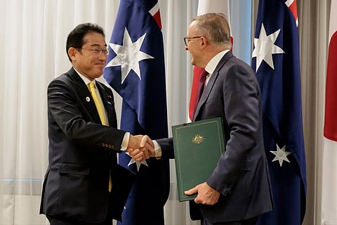 Australian PM Anthony Albanese, (R), shakes hands with Japan's PM Fumio Kishida after signing a new joint declaration on security cooperation, in Perth, Australia, Saturday, Oct 22, 2022. (Photo | AP)