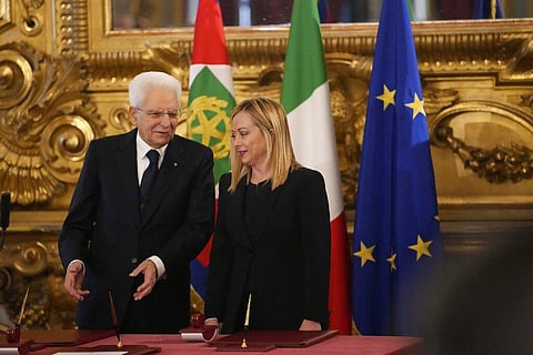 Italian President Sergio Mattarella,(L), is flanked by newly appointed Italian Premier Giorgia Meloni during the swearing in ceremony at Quirinal presidential palace in Rome. (Photo|AP)
