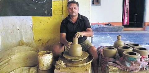 Ashok Chakradhari working at his house at Kumharpara in Kondagaon district of Chhattisgarh (above); the earthen lamp created by him | Express
