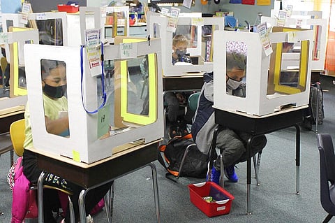 In this Oct. 19, 2020, file photo Michigan City, Ind., area school students return for in-person instruction after two months of remote learning to start the new school year. (Photo | AP)