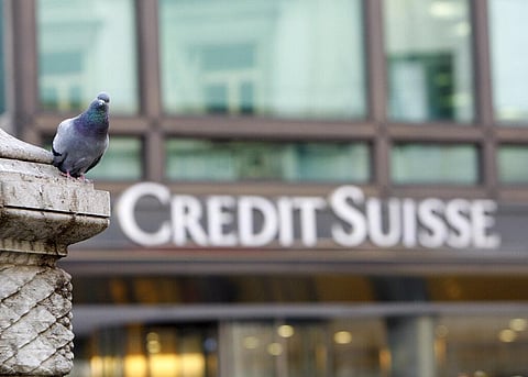 A pigeon rests near a building hosting offices of Credit Suisse bank in Milan (File Photo | AP)