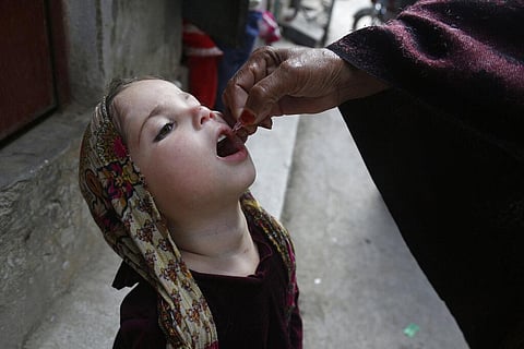 In this file photo, a health worker gives a polio vaccine to a child.(Photo | AP)