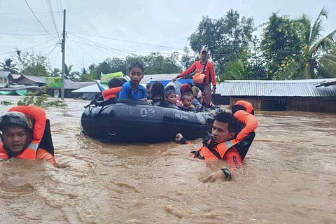 Rescuers use boats to evacuate residents from flooded areas due to Tropical Storm Nalgae at Parang, Maguindanao province, Oct. 28, 2022. (Photo | AP)