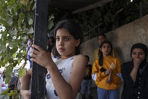 Relatives of Palestinian Bassel Basbous, killed at dawn by Israeli forces, mourn as they gather at the Al-Jalazun refugee camp. (Photo | AFP)