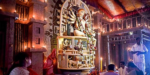 People visit a community Durga Puja pandal during the seventh day of the Durga Puja festival in Kolkata, Sunday, Oct. 2, 2022. (PTI)