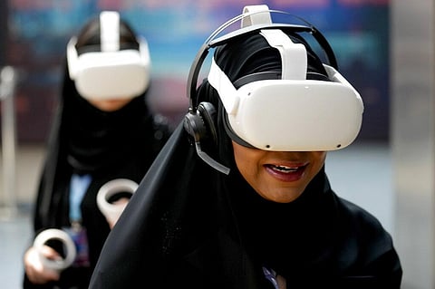 Women experience VR virtual reality goggles during the The Dubai Metaverse Assembly at the Emirates Towers, in Dubai, United Arab Emirates, Wednesday, Sept. 28, 2022. (Photo | AP)
