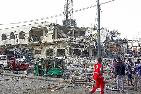Rescuers remove a seriously-injured body from the scene of a double car-bomb attack in the capital Mogadishu, Somalia Saturday, Oct. 29, 2022. (Photo | AP)