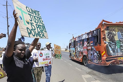 Kenyan activists demonstrate at a protest to highlight the effects of global warming and demand more aid for poor countries, in downtown Nairobi, Kenya Sept. 24, 2022. (Photo | AP)