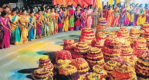 A large number of women participate in Bathukamma festivities at Padmakshi temple in Hanamkonda on Monday