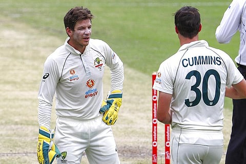 Australia's Tim Paine, left, talks with bowler Pat Cummins during play on day three of the fourth cricket test between India and Australia at the Gabba. (Photo | AP)