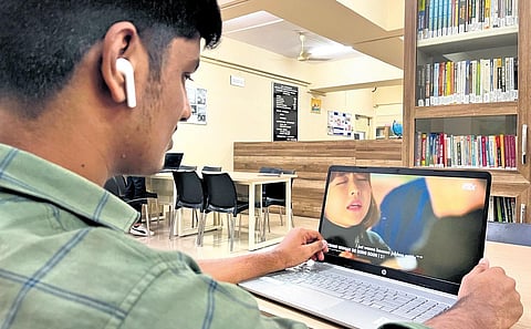 A citizen keenly watching a K-Drama with subtitles