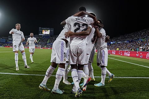 Real Madrid players celebrate after scoring the opening goal during La Liga soccer match between Getafe and Real Madrid (Photo | AP)