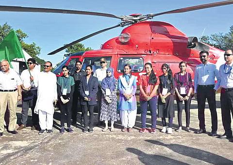 Meritorious school students who enjoyed the helicopter ride organised for them by the Chhattisgarh government on Saturday. (Photo| Express)
