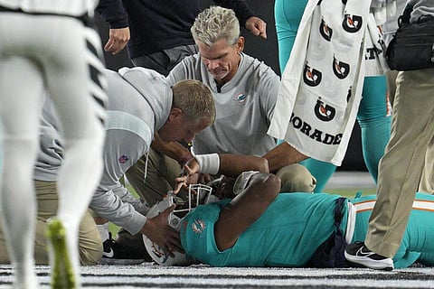 Miami Dolphins quarterback Tua Tagovailoa is examined during the first half of the team's NFL football game against the Cincinnati Bengals, on September 29, 2022, in Cincinnati. (Photo | AP)