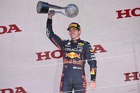 Red Bull Racing's Dutch driver Max Verstappen poses on the podium with the trophy following his victory at the Formula One Japanese Grand Prix at Suzuka, on October 9, 2022. (Photo | AFP)