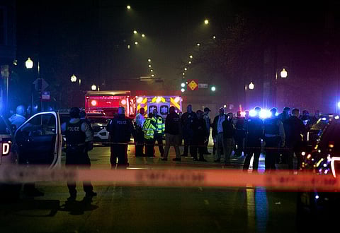 Chicago police and emergency medical responders work at the scene of a mass shooting on the city's West Side, Oct. 31, 2022. (Photo | AP)