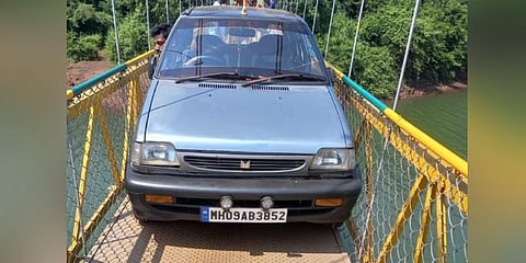 The Maharashtra registration car that attempted to cross the hanging bridge at Shivapura in Uttara Kannada district which was sent back by the locals. (Express)