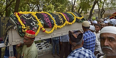 Mourners take part in a funeral procession while carrying the coffins of victims who died after a bridge across the river Machchhu collapsed at Morbi in India's Gujarat. (Photo | AFP)