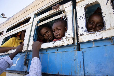 Refugees who fled the conflict in Ethiopia's Tigray region ride a bus going to the Village 8 temporary shelter, near the Sudan-Ethiopia border, in Hamdayet, on Dec. 1, 2020. (Photo | AP)