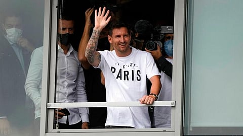 In this file image, Lionel Messi waves after arriving at Le Bourget airport, north of Paris.