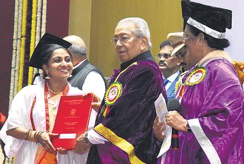 Governor Biswa Bhusan Harichandan presents PhD degree to a student at the convocation of SPMVV in Tirupati on Friday | Madhav K