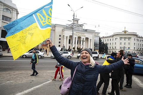Ukrainians gather in downtown to celebrate the recapturing of their city Kherson, Ukraine, Nov. 12, 2022. (Photo | AP)