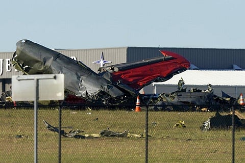 Debris from two planes that crashed during an airshow at Dallas Executive Airport lie on the ground. (Photo | AP)