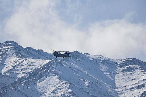 File photo of Indian Air Force (IAF) Chinook helicopter flies amid the prolonged India-China stand off in the Ladakh region, in Leh. (Photo | PTI)