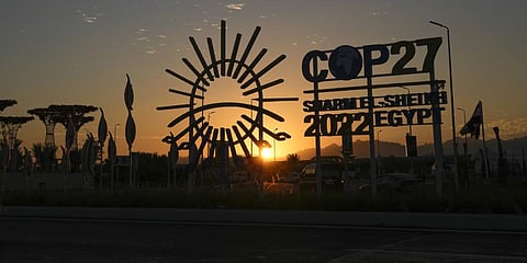 The sun sets behind the COP27 logo outside the venue of the COP27 U.N. Climate Summit, Saturday, Nov. 12, 2022.(Photo | AP)