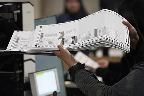 An election worker processes ballots at the Clark County Election Department, Friday, Nov. 11, 2022, in Las Vegas. (Photo | AP)